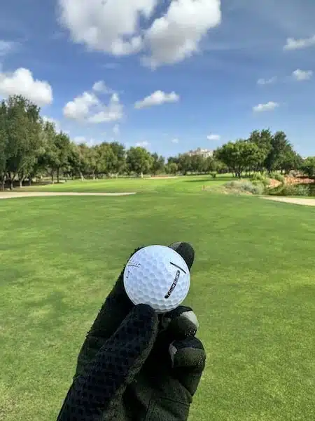 titleist-tour-soft ball in hand on golf course personal