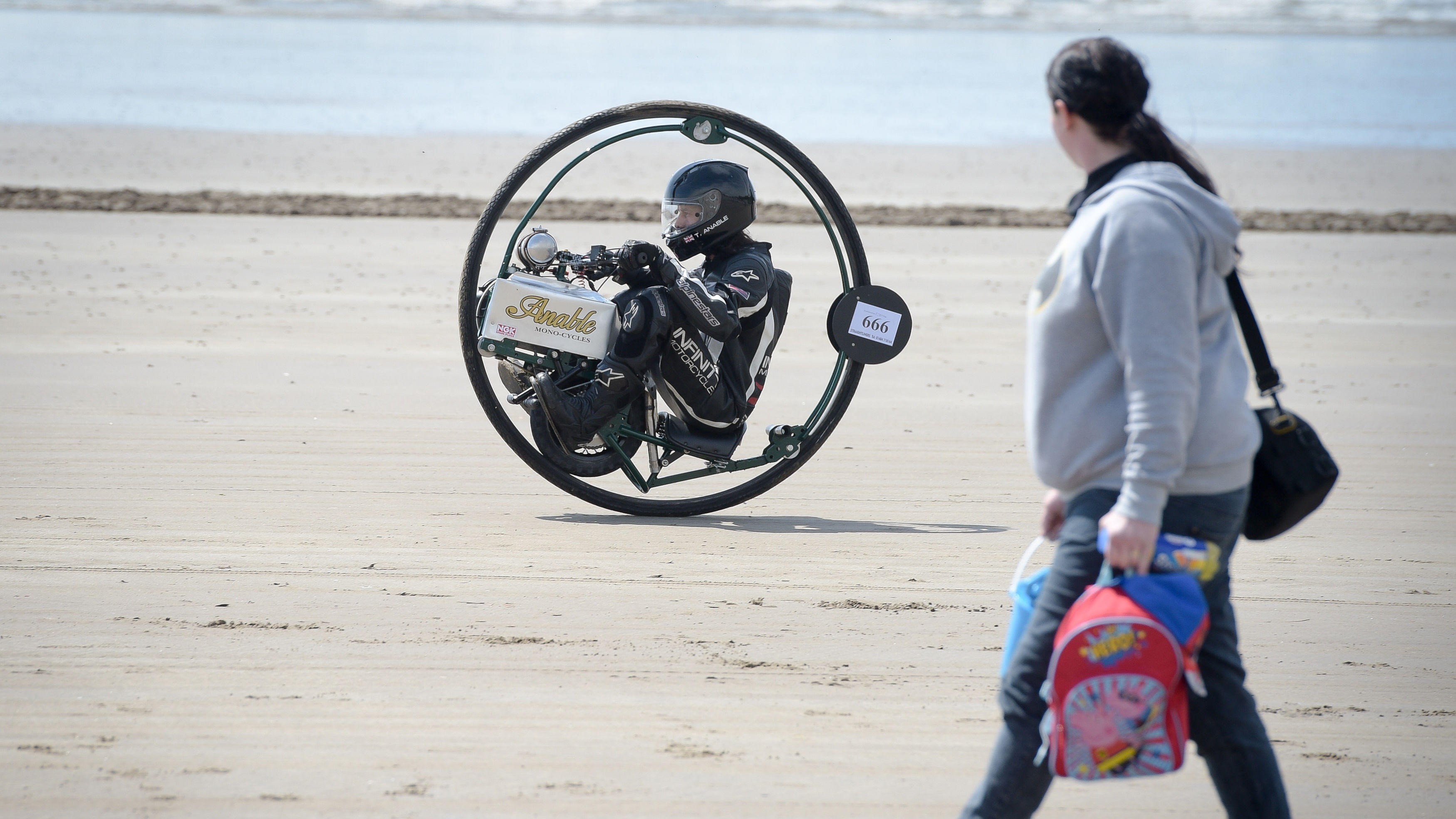 A man practices for a monowheel race in Wales, UK.