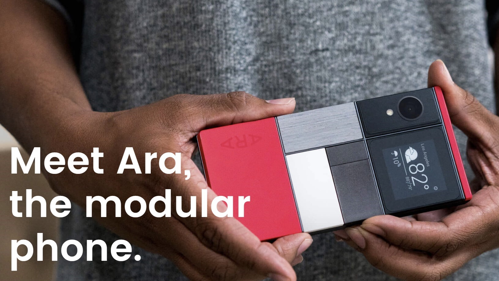 A person holds up a modular Ara phone in an advertisement campaign.