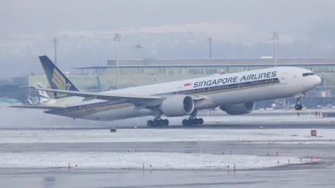 Reuters Singapore Airlines Plane seen landing on a runway
