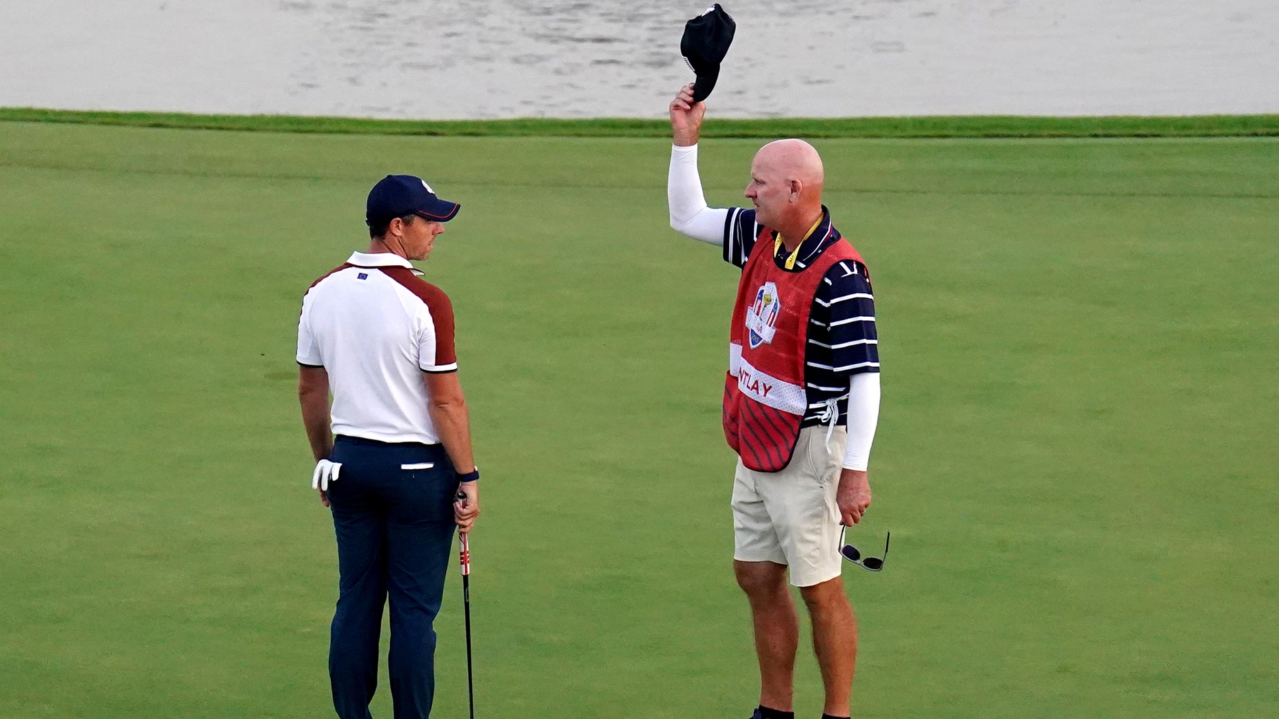 joe lacava waves hat at rory mcilroy at ryder cup