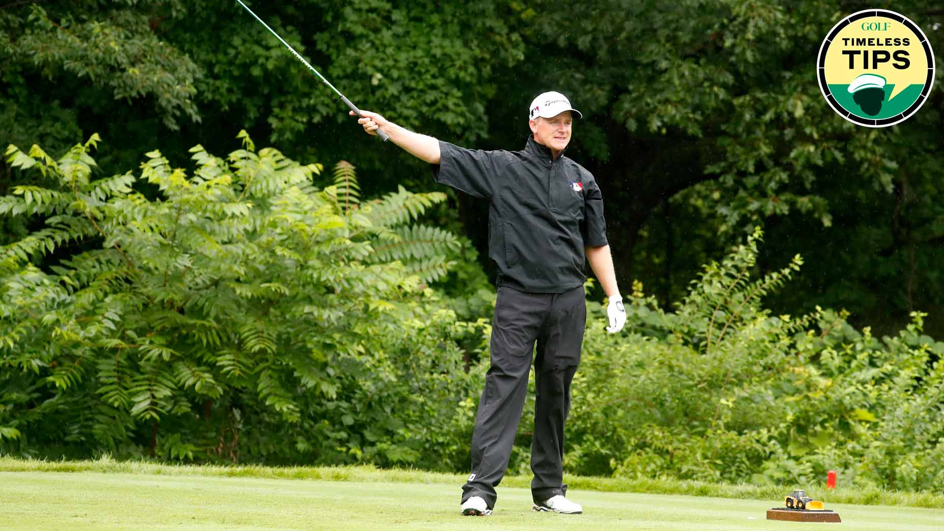 PGA Tour pro raises his driver during the 2023 john deere classic