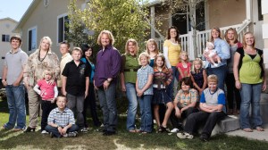 SISTER WIVES, Kody Brown (center), with wives and children, (Season 1), 2010-. photo: Joe Pugliese / © TLC / Courtesy: Everett Collection