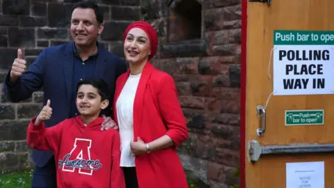 PA Media Scottish Labour leader Anas Sarwar, pictured with his wife Furheen and son Aliyan