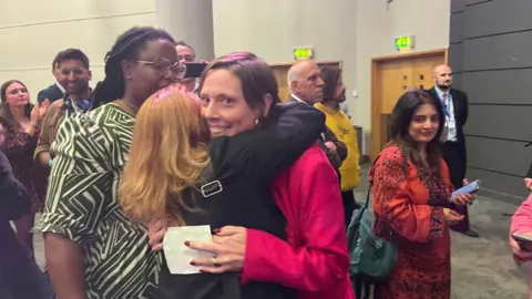 Jess Phillips hugs a woman at the election count