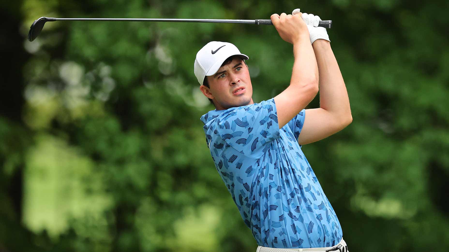 Davis Thompson hits a shot at the John Deere Classic.