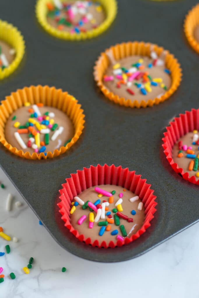 A close-up of a Freezer Fudge Bite in the pain with sprinkles on it.