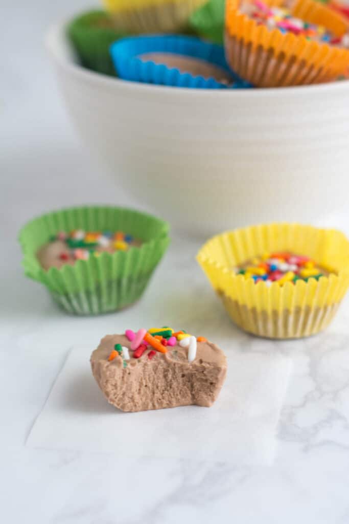 A cottage cheese freezer fudge bite with a bite taken out of it.