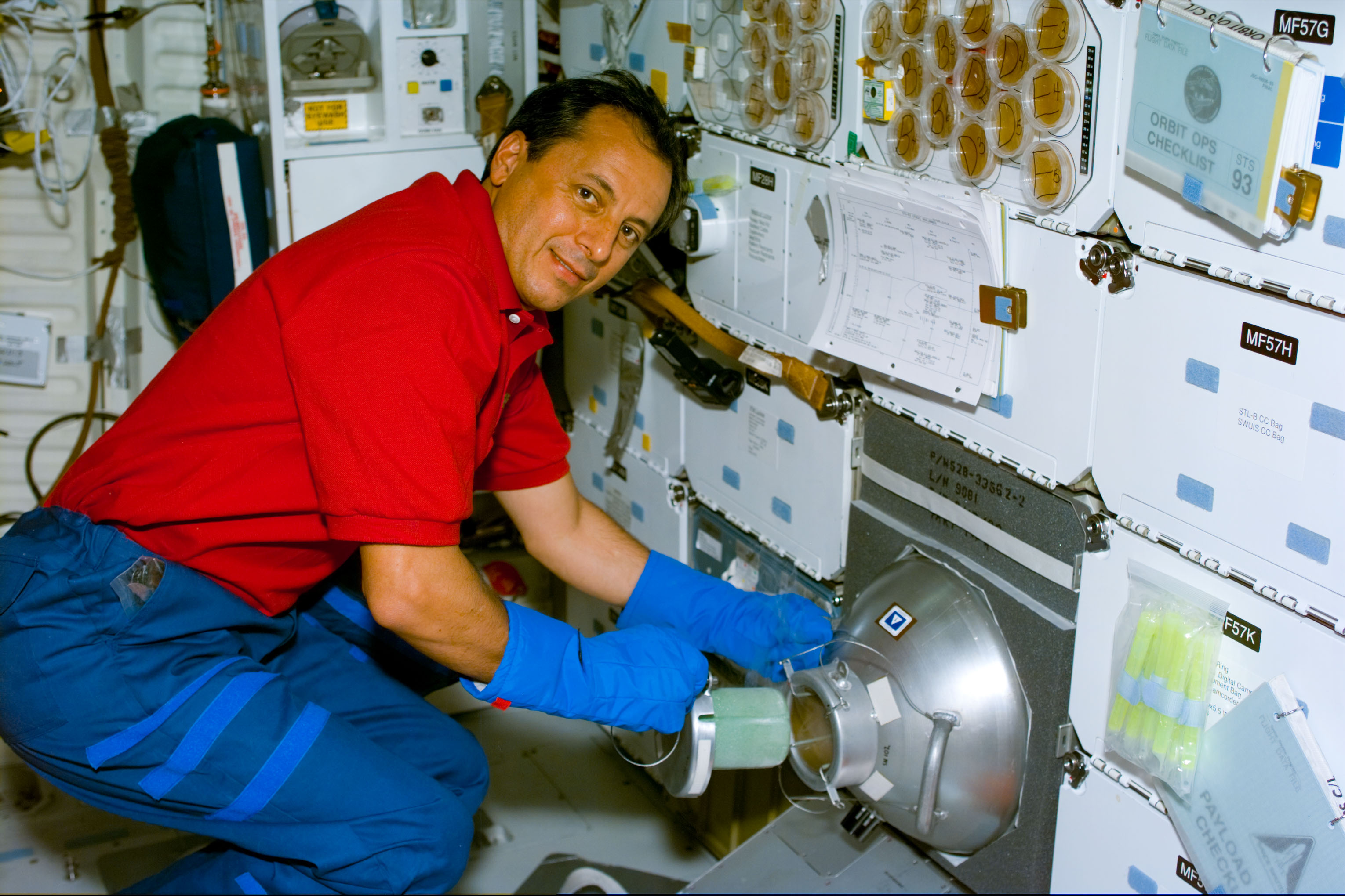 Tognini places samples of the Biological Research in Canisters experiment into a gaseous nitrogen freezer