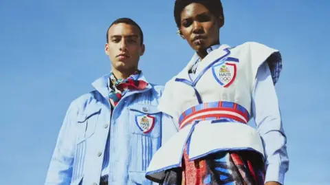 Stella Jean/Eugenio D'Orio A man and a woman wearing Haiti's Olympic uniform