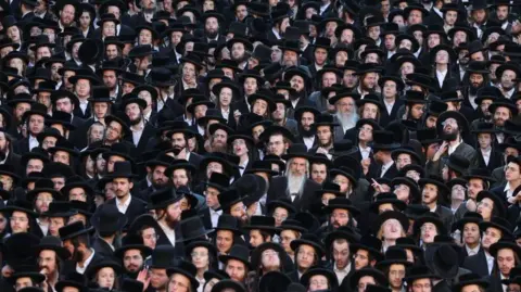 EPA Thousands of ultra-Orthodox Jews protest against the new army recruitment law, in Jerusalem