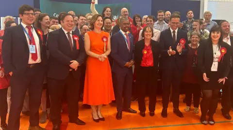 BBC Wales' First Minister Vaughan Gething with winning Labour candidates and supporters at the count in Cardiff 