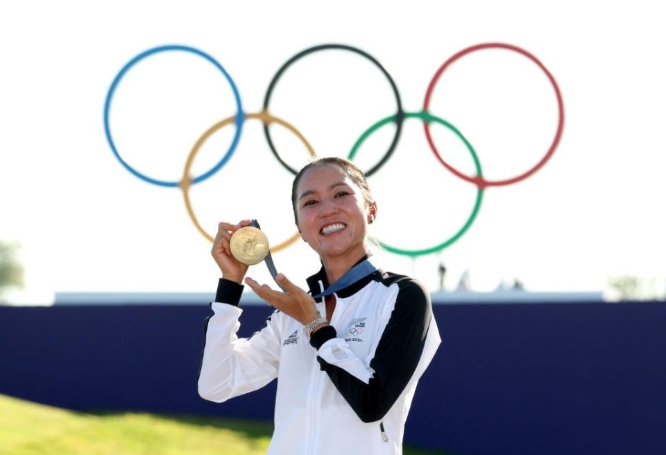 Lydia Ko of New Zealand displays her Olympic gold medal.