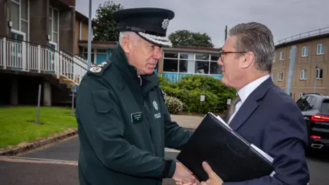 PSNI Jon Boutcher shakes hands with Sir Keir Starmer