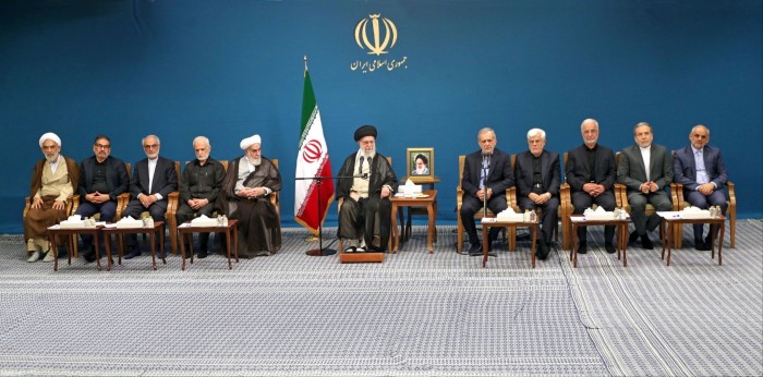 Ayatollah Ali Khamenei, centre, looks on as President Masoud Pezeshkian, fifth from left, speaks at a meeting in Tehran