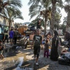 Palestinians carry their belongings on their way to migrate for safer areas following the Israeli army's warning to evacuate the Dawa Faculty of the Ministry of Endowments in Deir al-Balah, Gaza, on Monday.