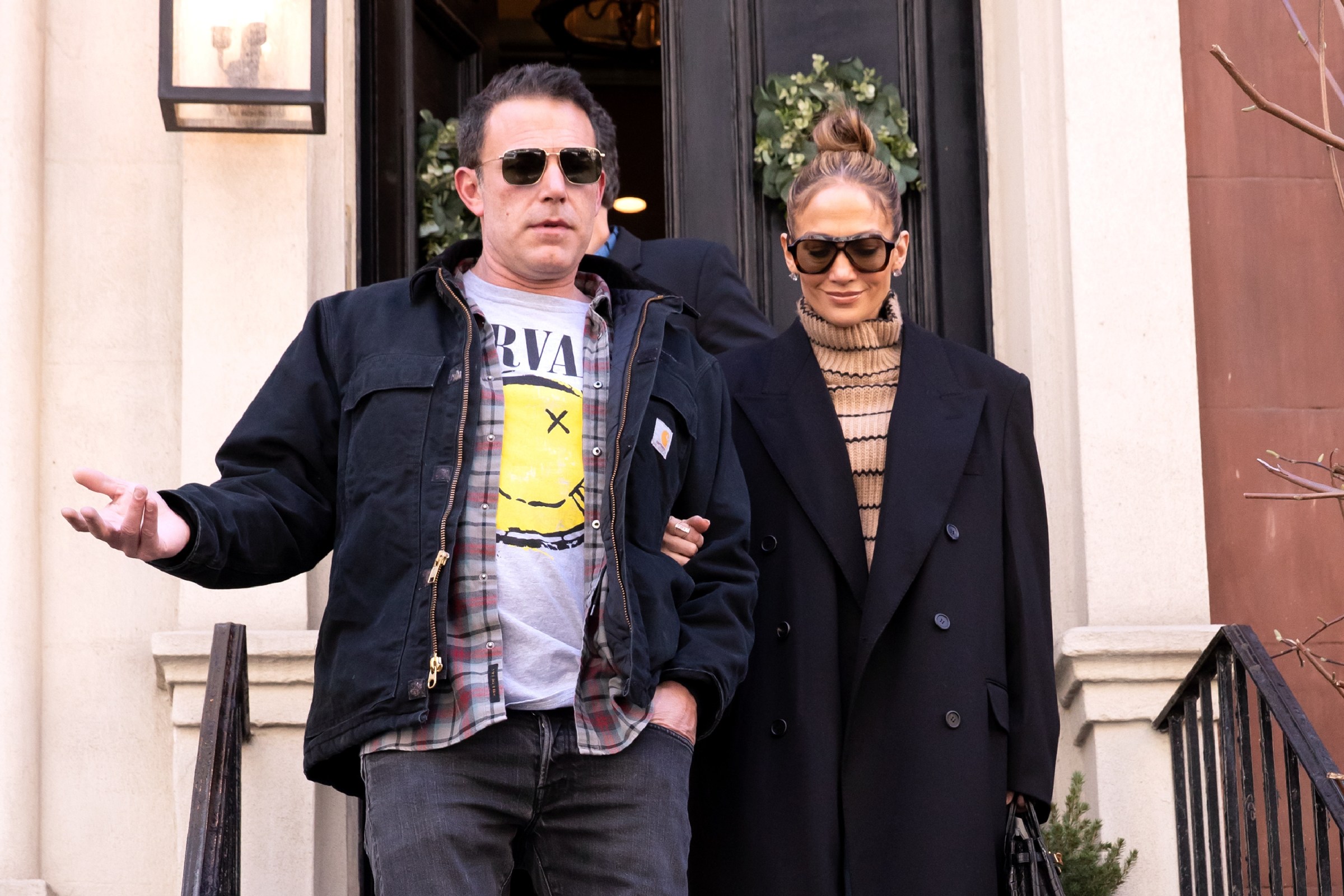 Affleck and Lopez walking out of a brownstone on March 30, 2024 in New York.