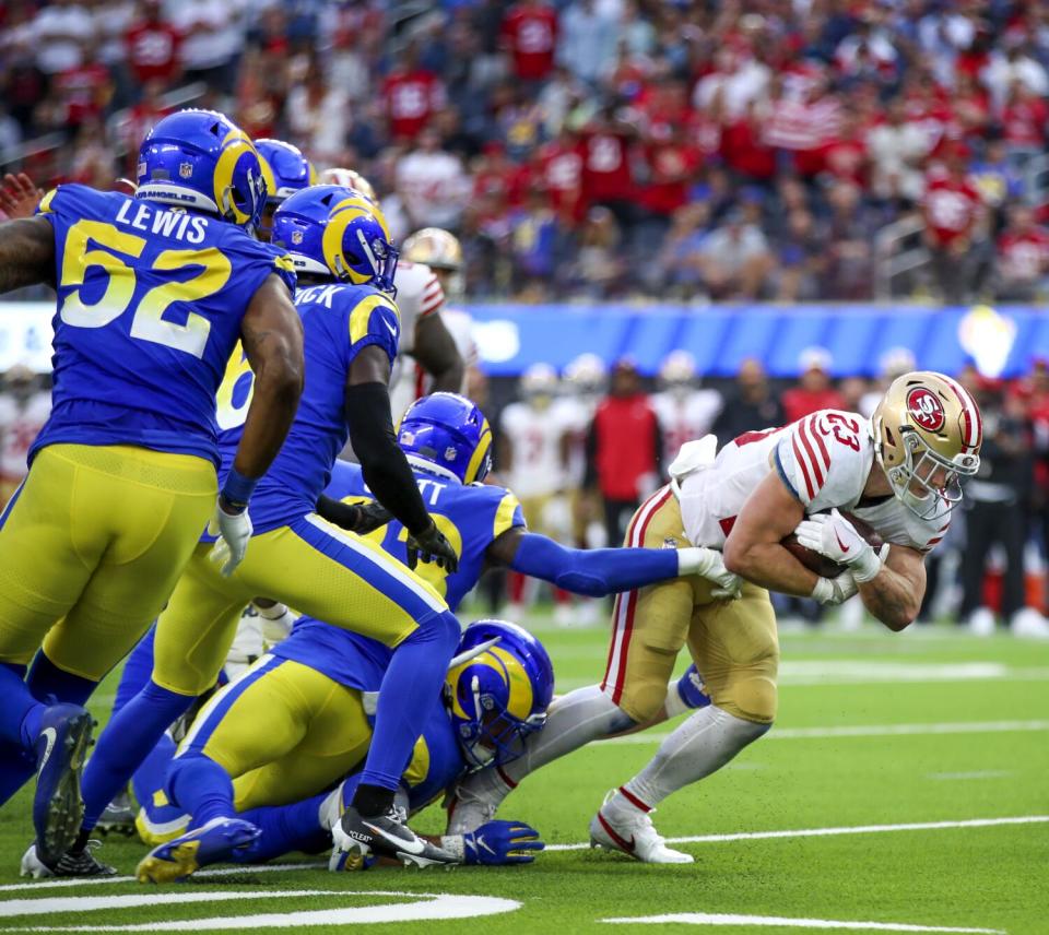 San Francisco 49ers running back Christian McCaffrey (23) breaks away from the Rams defense last season.