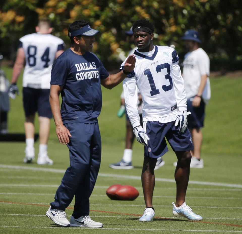 Dallas Cowboys wide receivers coach Sanjay Lal talks to receiver Michael Gallup in 2019.