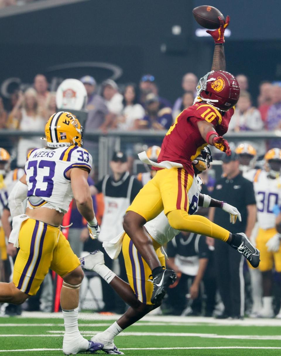 USC wide receiver Kyron Hudson makes a one-handed catch for 24 yards in front of LSU safety Major Burns.