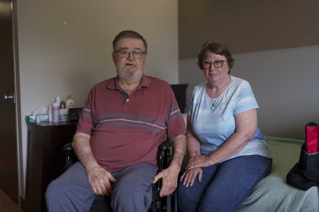 Sherwood and Cindie Haakenson sit in Sherwood’s room at the Heart of America Medical Center long-term care facility in Rugby, N.D.