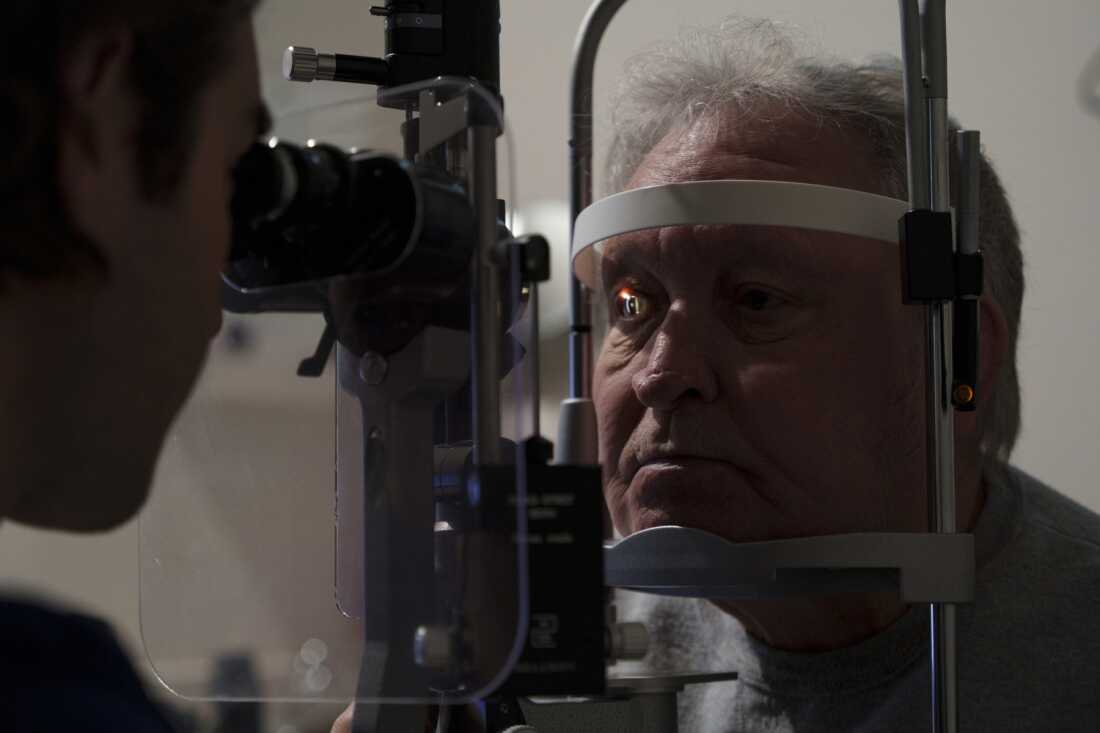 Randy Anderson has his eyes examined by Dr. Andrew Rodenburg during an optometry appointment on May 22. Anderson has to drive over an hour to Bismarck, N.D., to seek specialty care a few times a week on average, despite living two blocks from his small town’s hospital and clinic. 