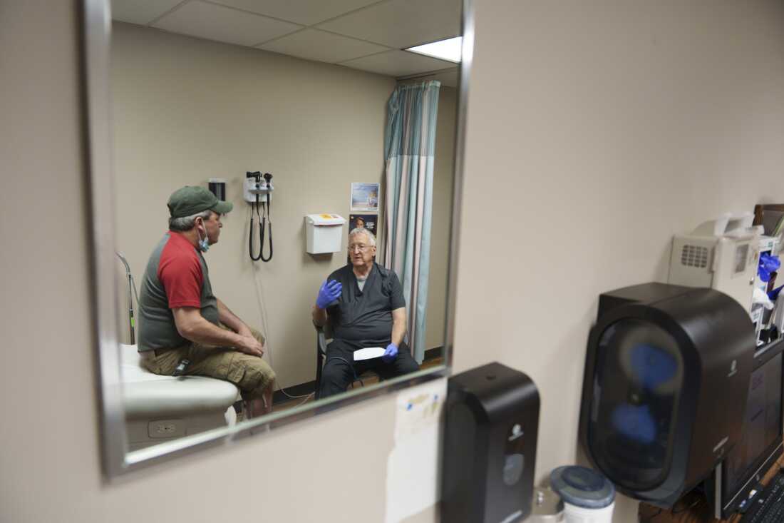 Dr. William L. Bender screens a patient with flu-like symptoms at the Heart of America Medical Center in Rugby, N.D., on May 14. Increasing numbers of rural hospitals such as Heart of America have become dependent on temporary contract providers such as Bender to fill their ranks as they struggle to recruit long-term practitioners. While these providers can offer a high level of care, they are more expensive to employ and do not ensure staffing stability over time.