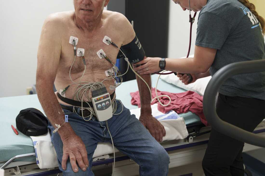 A nurse checks a patient’s pulse following a cardiac stress test during a special monthly visit by a cardiology team to Douglas County Memorial Hospital in Armour on May 30.