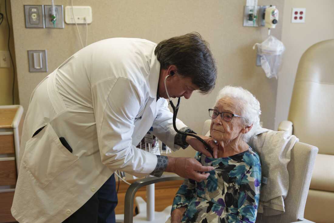 Dr. Richard Clark, a cardiologist from the Sanford Cardiovascular Institute, and a team of nurses spend a day each week traveling from their Sioux Falls offices to one of four rural hospitals that do not have cardiologists on staff. He checks a patient’s heartbeat during a monthly visit to Douglas County Memorial Hospital in Armour.