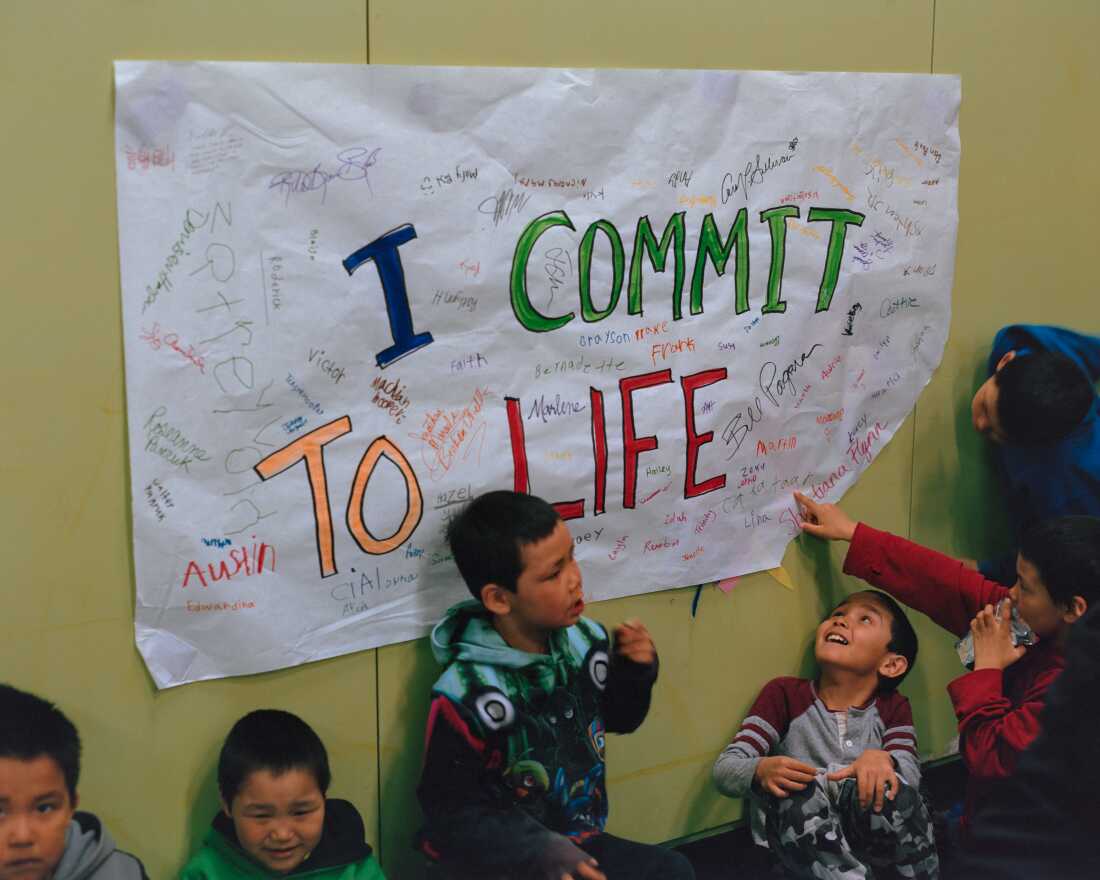 At the Lower Kuskokwim Dance Festival in Tununak, students are given opportunities to learn about mental health programs alongside a range of cultural activities such as Yup’ik singing and dancing. School social worker Jim Biela, who uses aspects of Qungasvik in his curriculum, asked students to sign posters with various affirmations in preparation for the festival.