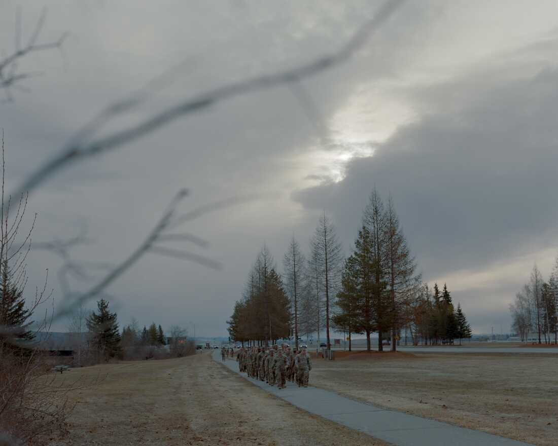 A group of soldiers from the 1st Brigade Combat Infantry Division march in formation outside Bassett Military Hospital at Fort Wainwright in Fairbanks. In 2021 there were 17 suicides in the division, giving it one of the highest rates among a military unit nationwide. 