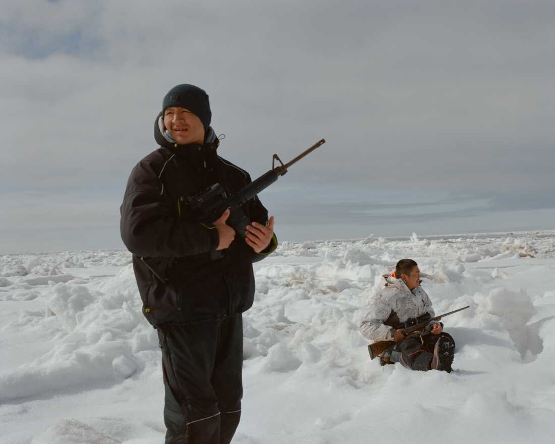 James Joseph (left) and Albert Simon (right) scout for game on an ice floe several miles offshore of Hooper Bay, Alaska. Both have lost close friends to suicide. Despite seal hunting being identified by CANHR as a protective activity they’d like to support, the organization has had trouble getting funding for it over liability concerns. 