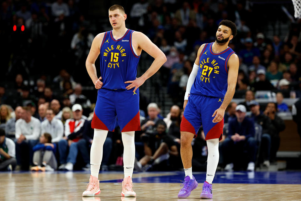 MINNEAPOLIS, MINNESOTA - MARCH 19: Nikola Jokic #15 and Jamal Murray #27 of the Denver Nuggets look on against the Minnesota Timberwolves in the third quarter at Target Center on March 19, 2024 in Minneapolis, Minnesota. The Nuggets defeated the Timberwolves 115-112. NOTE TO USER: User expressly acknowledges and agrees that, by downloading and or using this photograph, User is consenting to the terms and conditions of the Getty Images License Agreement. (Photo by David Berding/Getty Images)