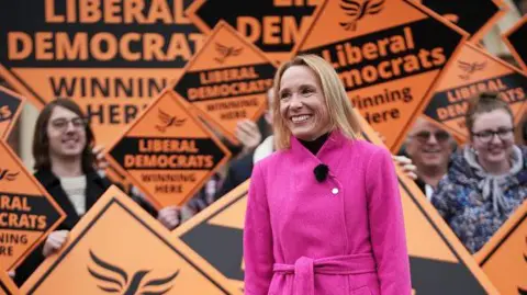 PA Media Lib Dem MP Helen Morgan with activists in 2021