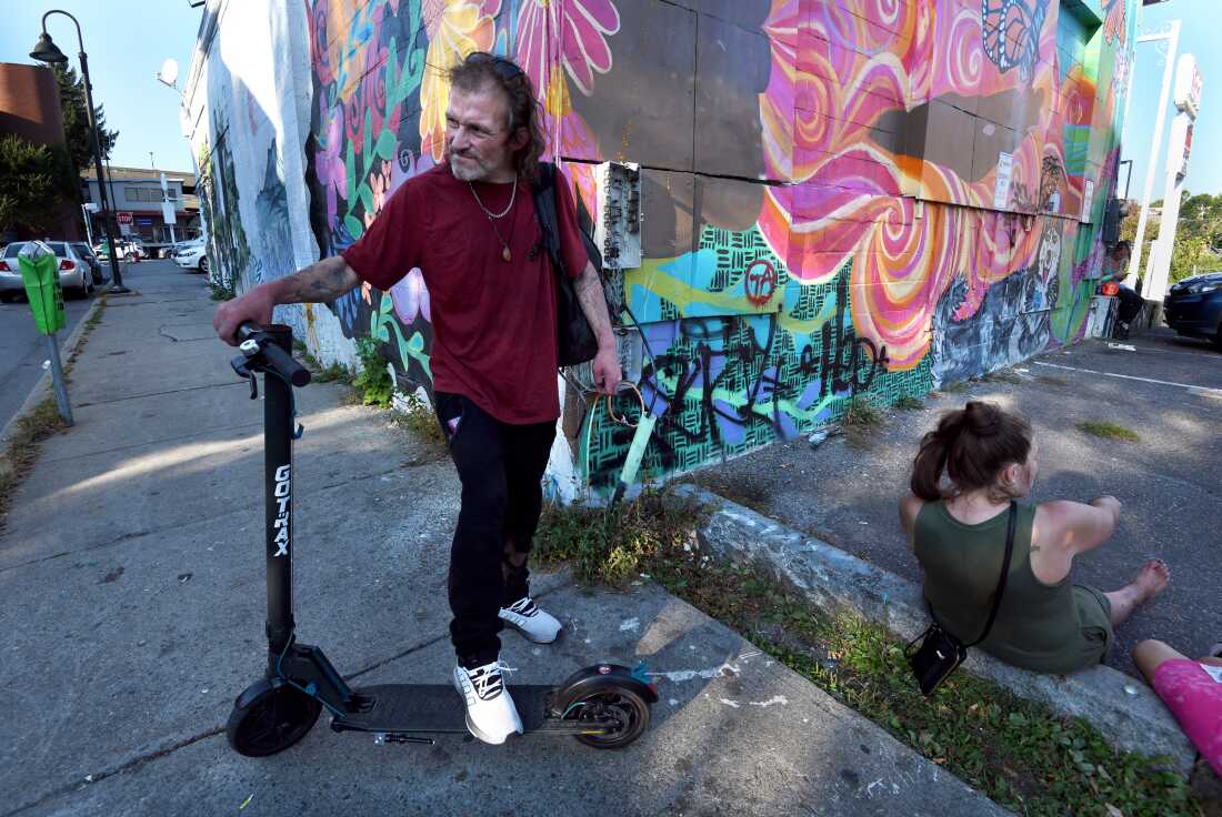 Kevin Donaldson, who lives with addiction, shown on a street corner in Burlington, Vermont, on September 16, 2024.  He said members of his community have learned better ways to look out for each other as illicit drugs have grown more toxic.