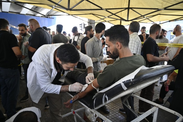 A man donates blood, one day after pagers explosions, in the southern suburb of Beirut