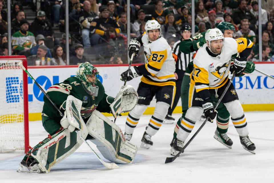 Marc-Andre Fleury (Minnesota Wild) battling his old teammate Sidney Crosby. © Matt Blewett