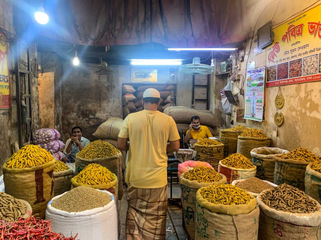 Bright yellow turmeric roots stand out among other spices that retailers sell at Shyambazar, Bangladesh’s largest wholesale spice market.