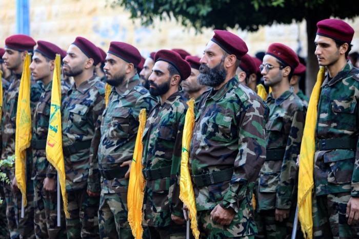 Hezbollah fighters take part in a funeral procession