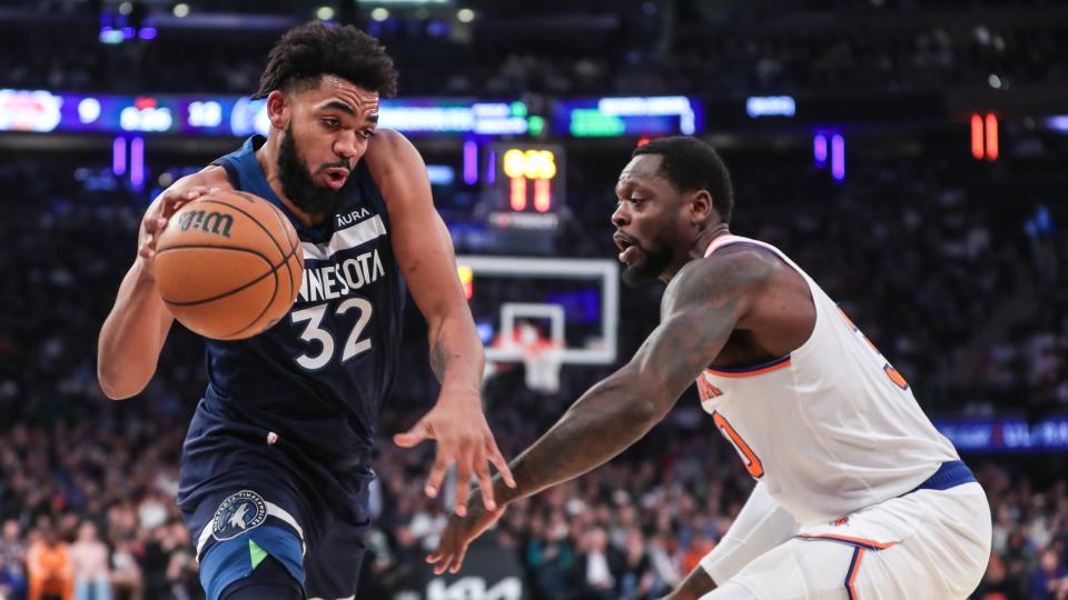 Minnesota Timberwolves center Karl-Anthony Towns (32) looks to drive past New York Knicks forward Julius Randle (30) in the first quarter at Madison Square Garden.