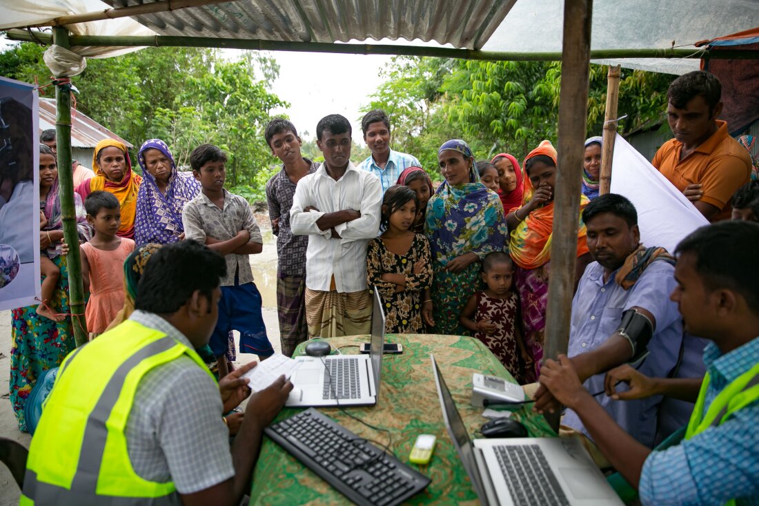 Patients line up for remote health consultation sessions near Rangpur, Bangladesh.