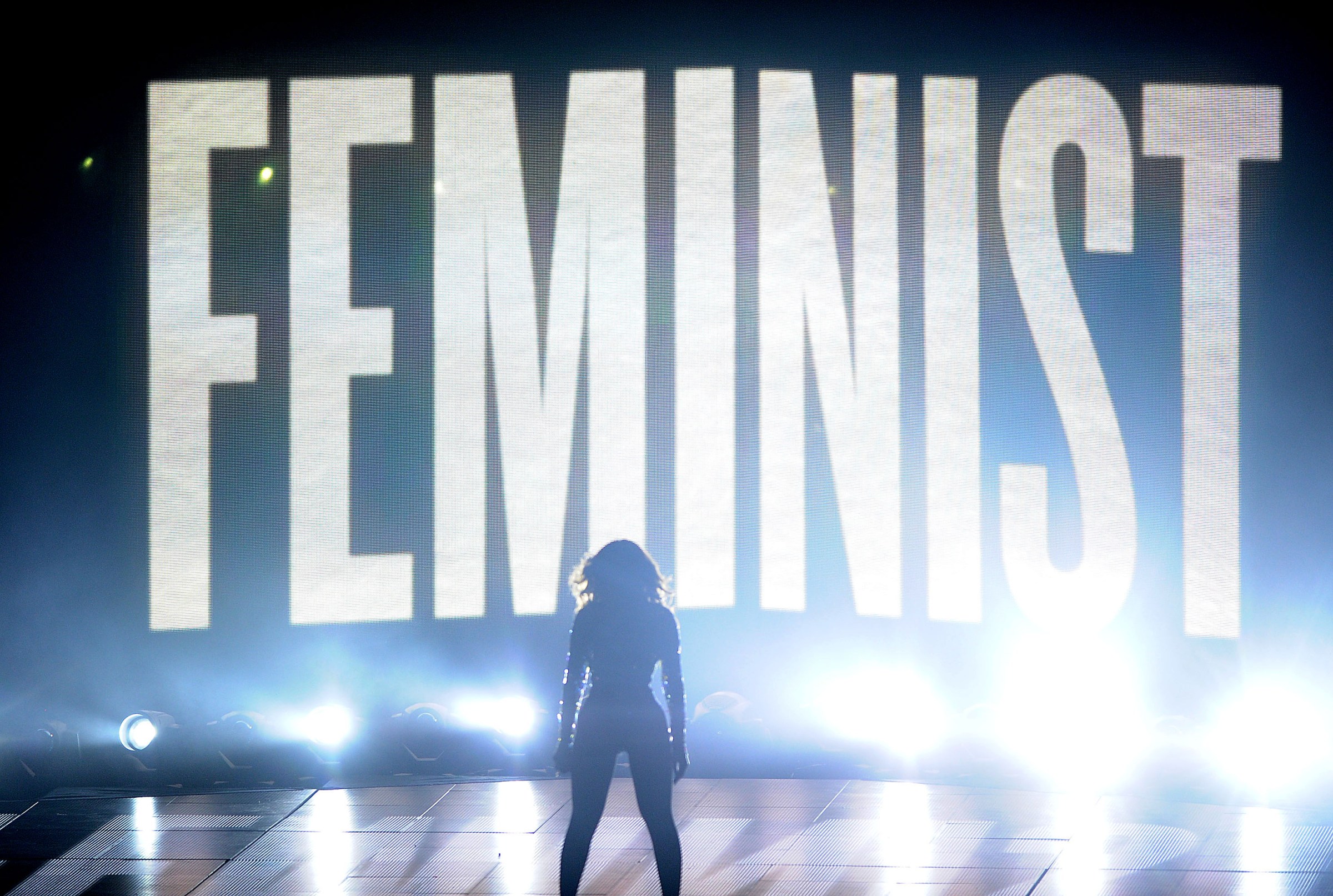 Beyonce onstage in front of the word “feminist” writ large.