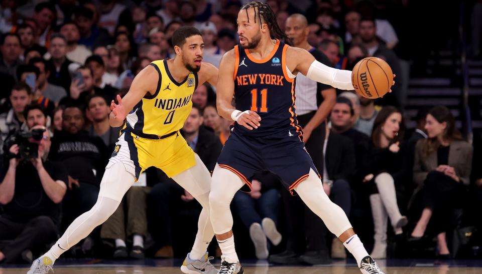 New York Knicks guard Jalen Brunson (11) controls the ball against Indiana Pacers guard Tyrese Haliburton (0) during the first quarter at Madison Square Garden.