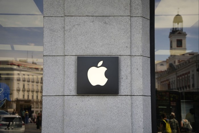 An Apple logo  on the side of a store in Madrid