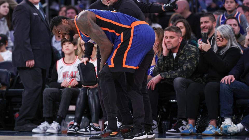 Jan 27, 2024; New York, New York, USA; New York Knicks forward Julius Randle (30) is helped by medical staff after an injury during the second half against the Miami Heat at Madison Square Garden.