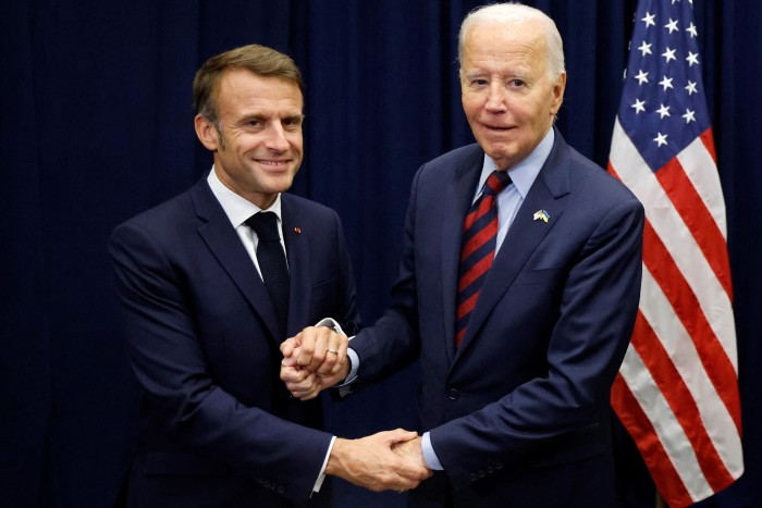 French President Emmanuel Macron shakes hands with US President Joe Biden