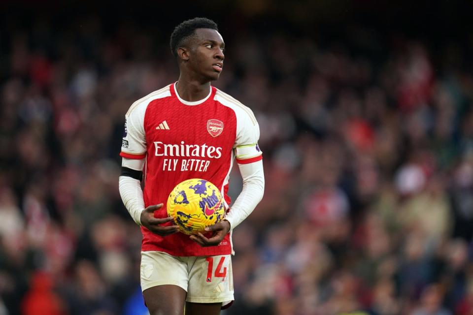 Nketiah takes away the match ball after scoring a hat-trick for Arsenal against Sheffield United (John Walton/PA)