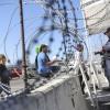 A U.S. Customs and Border Protection agent checks pedestrians' documentation at the San Ysidro Port of Entry in San Ysidro, California.  A growing number of experts believe the flow of deadly street fentanyl from Mexico into the U.S. has been disrupted, contributing to a drop in fatal overdoses.