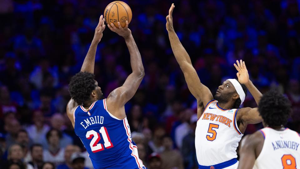 Apr 25, 2024; Philadelphia, Pennsylvania, USA; Philadelphia 76ers center Joel Embiid (21) shoots past New York Knicks forward Precious Achiuwa (5) during the first half of game three of the first round for the 2024 NBA playoffs at Wells Fargo Center. Mandatory Credit: Bill Streicher-USA TODAY Sports