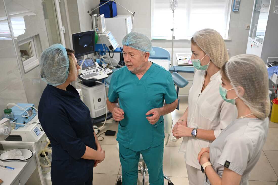 Dr. Stefan Khmil communicates with medical personnel in his medical center in Lviv, Ukraine, on July 12.